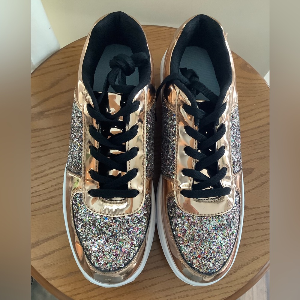 Sparkly gym shoes or running shoes, goldish coppery with lots of sparkle. Size 9